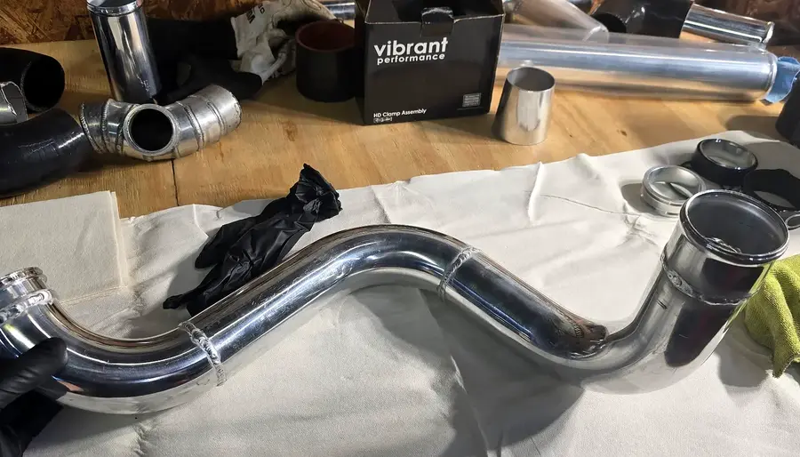 Polished custom aluminum charge-pipe assembly