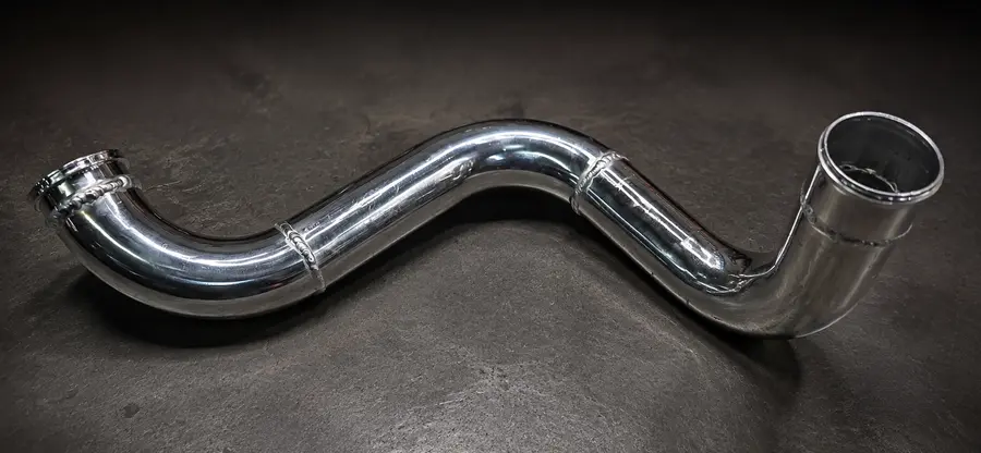 Finished polished aluminum charge-pipe assembly
