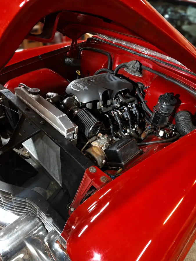 Classic Cadillac LS engine bay — LS/Vortec installation with cooling, intake and accessory packaging.