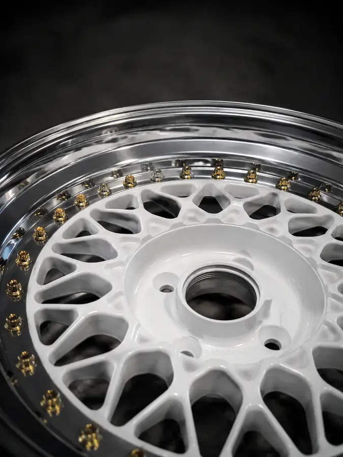 Three-piece wheel assembly — Polished lip, refinished center and carefully installed hardware.