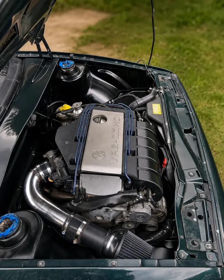 Volkswagen VR6 engine bay — Clean VR6 packaging with a custom intake path.